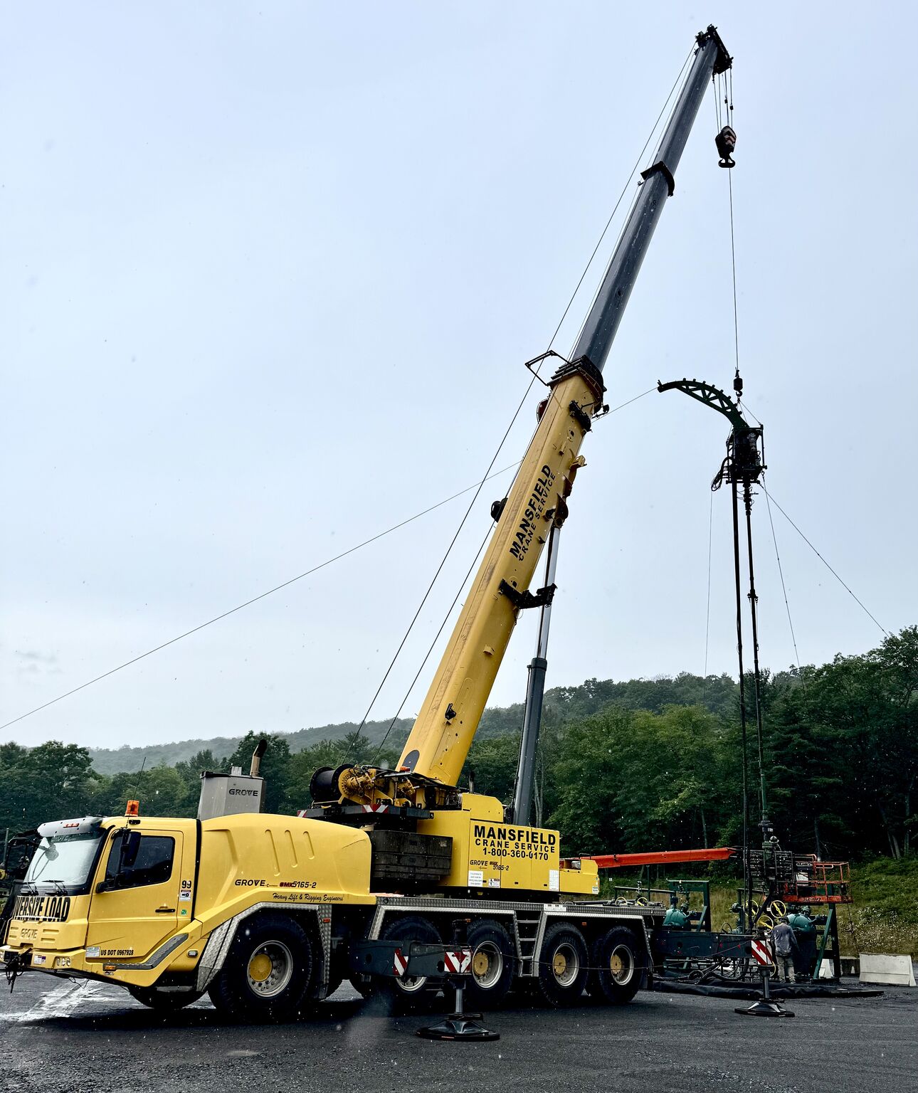 appalachian_basin A crane lifting a very large metal LP tank