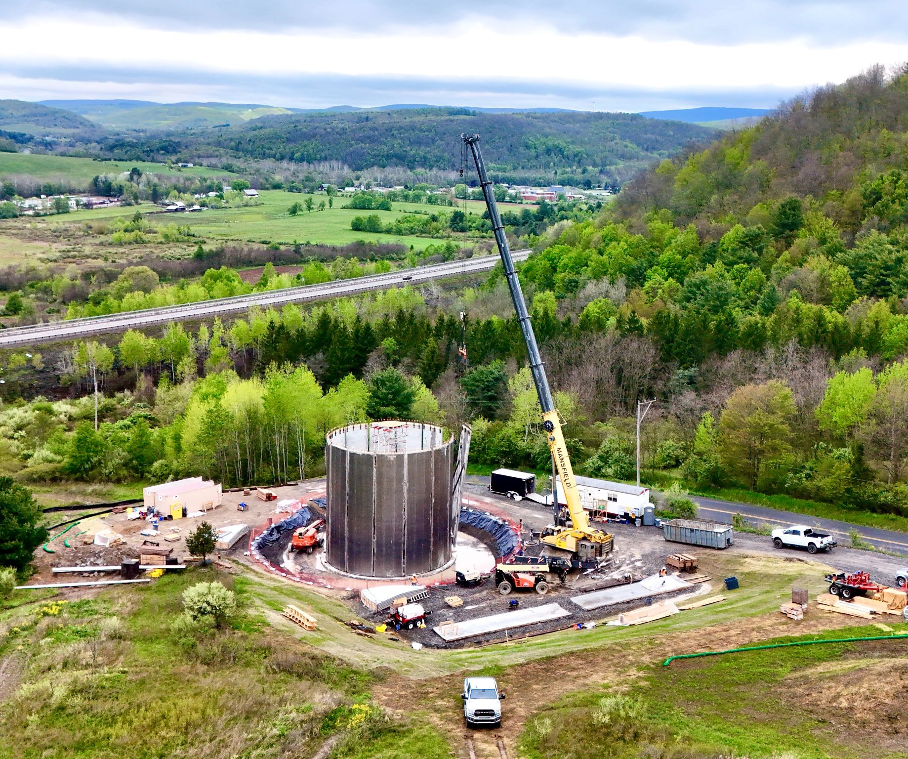 water storage A crane lifting a very large metal LP tank